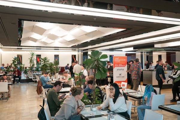 Attendees in the lunch area at the Grandior Hotel Prague during EUSECON 2026